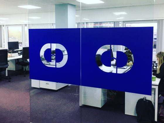 Printed logo manifestation applied to office glazing